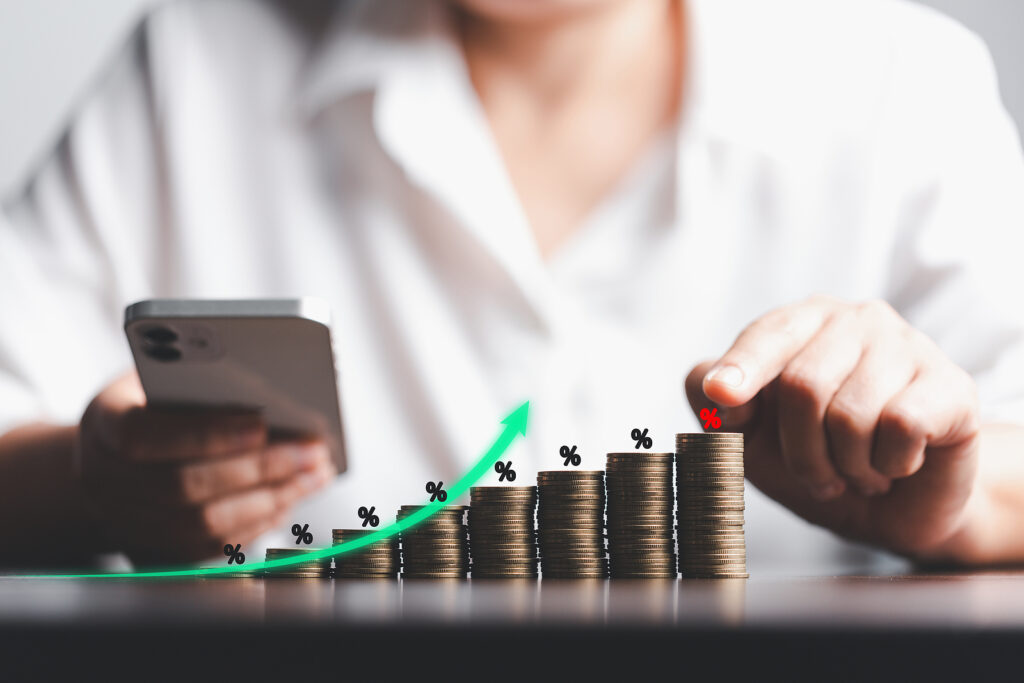 Women with piles of coins